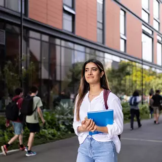 Student walking through campus