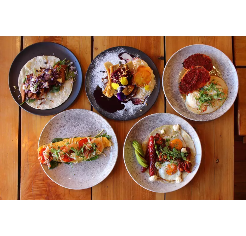 Birdseye view of 5 different meals at the Greedy Cow in Mackenzie.