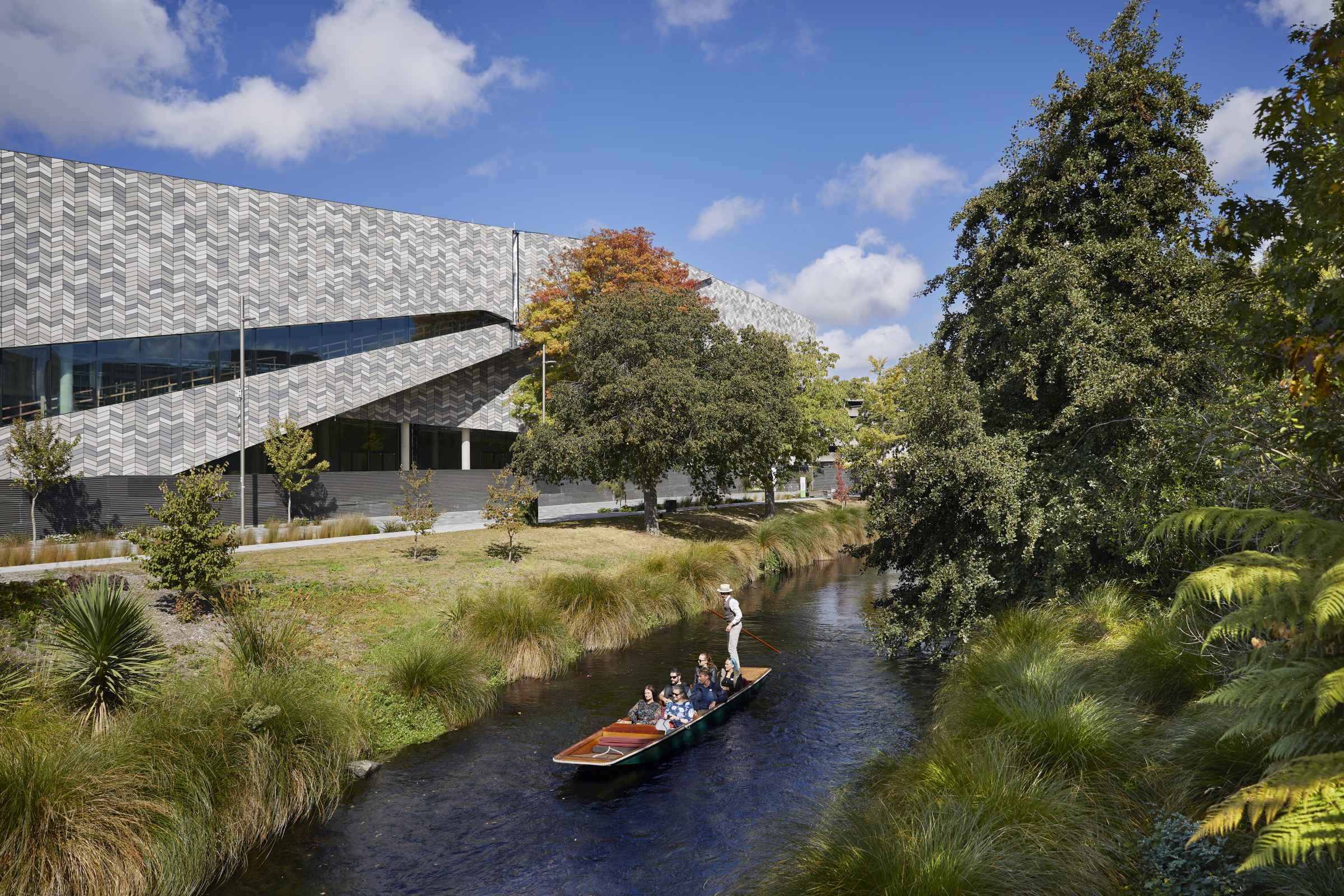 A group punts along the front of Te Pae Christchurch 